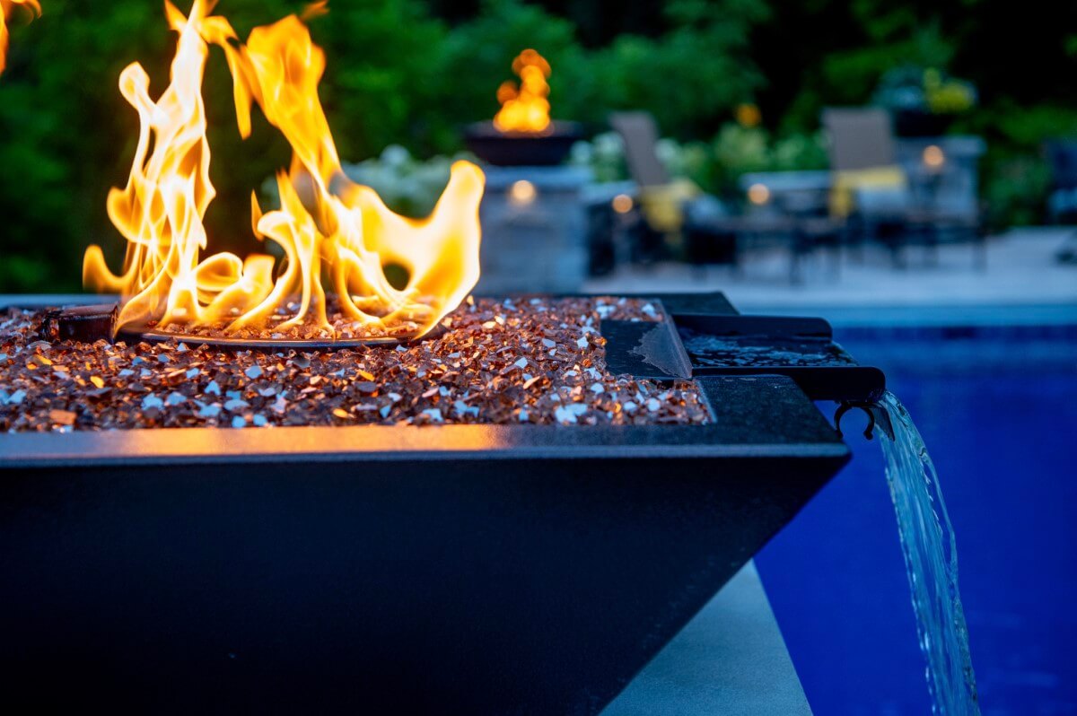 torch with waterfall at night