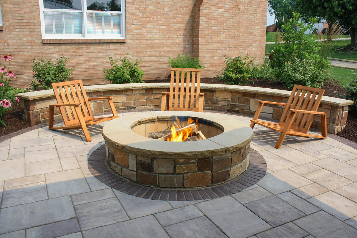 fireplace with wooden chairs