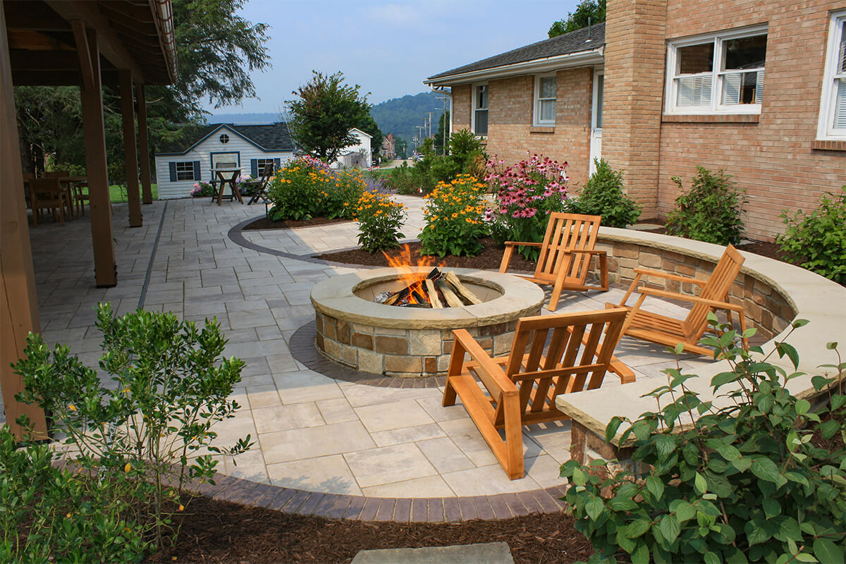 outside retreat with fireplace and chairs visible